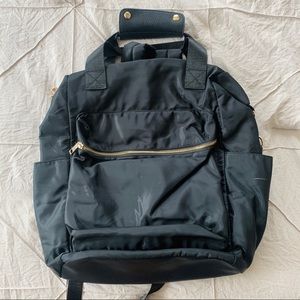 A NEW DAY black and gold backpack